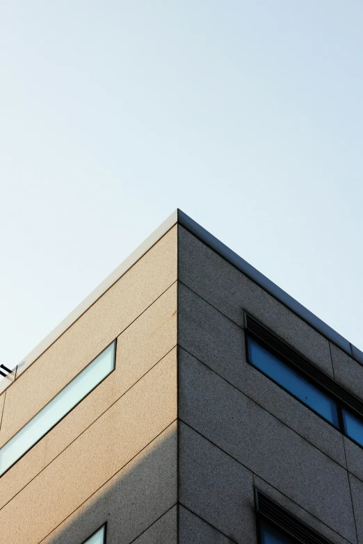 the tops of a building with a bird in the sky