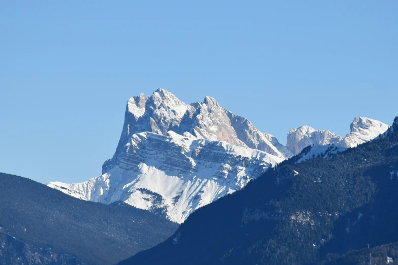 a snowy mountain range with snow covered mountains