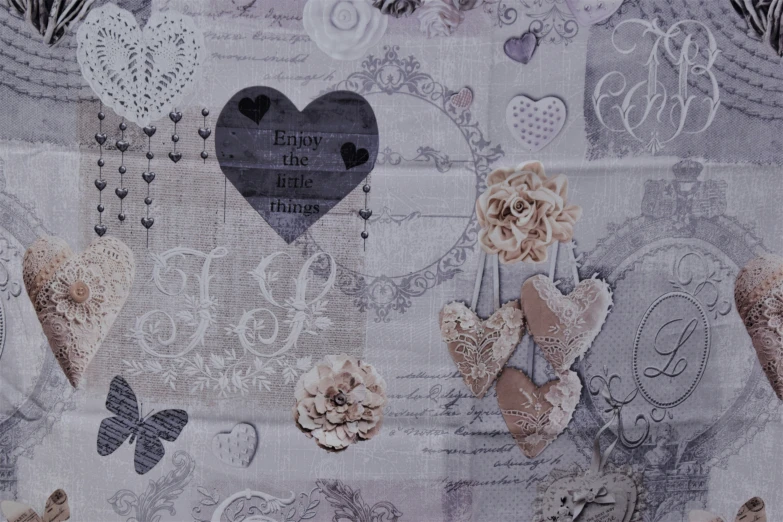 a scarf with flowers and hearts on it