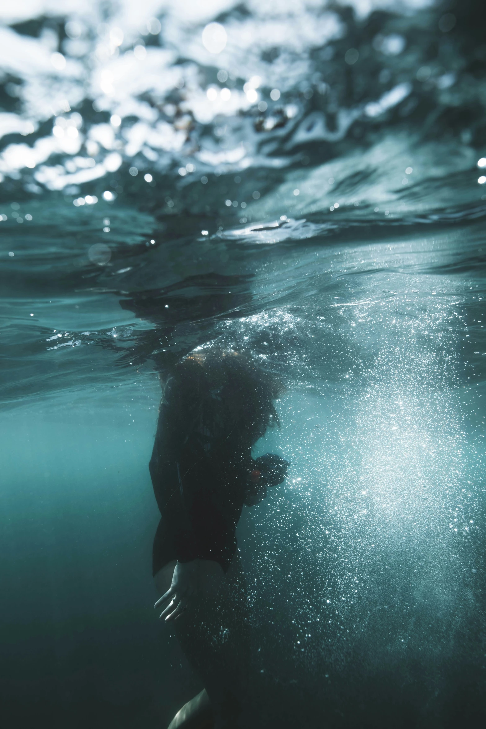 a person that is swimming under water in the ocean