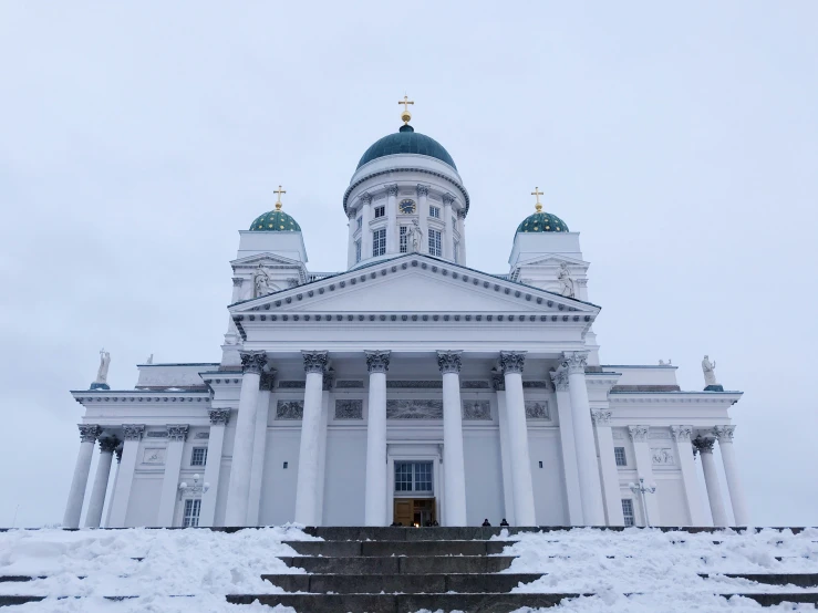 a large white building with some steps leading to it