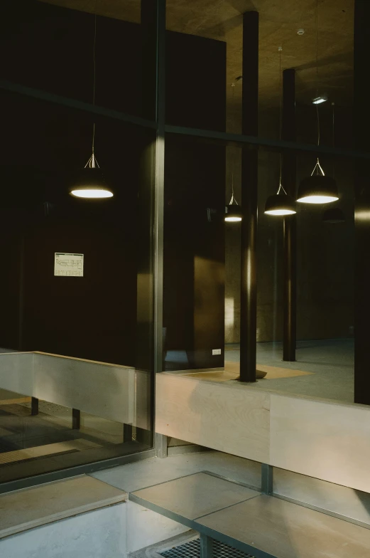 three lamps are shown above the glass on the floor