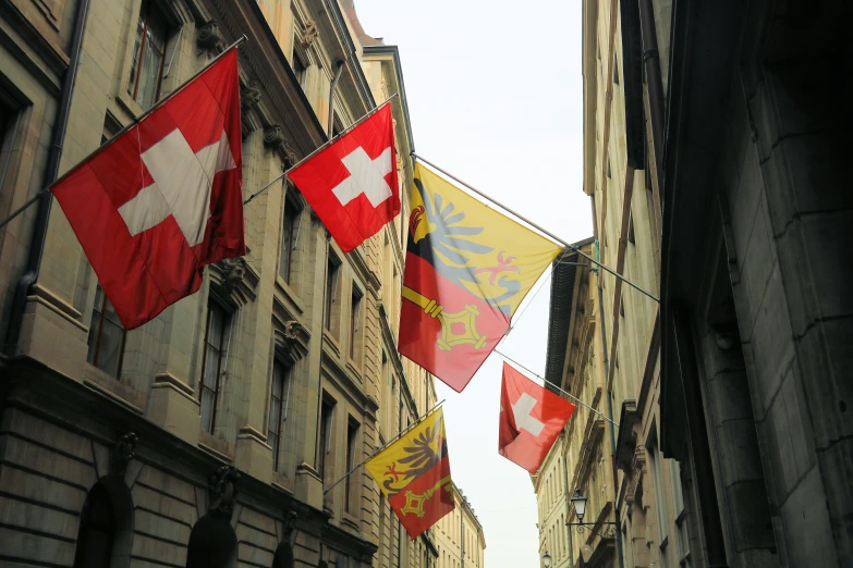 there is a bunch of flags hanging on the building