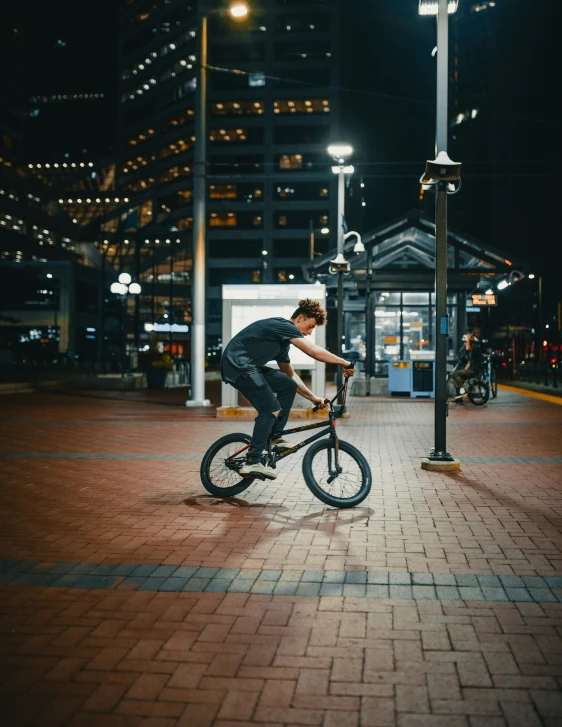 a man riding a bike on a street