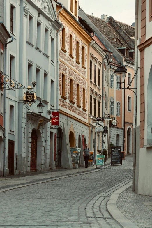 a street with people and some buildings on it