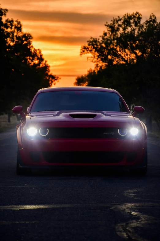 this is a nice looking red car on a road