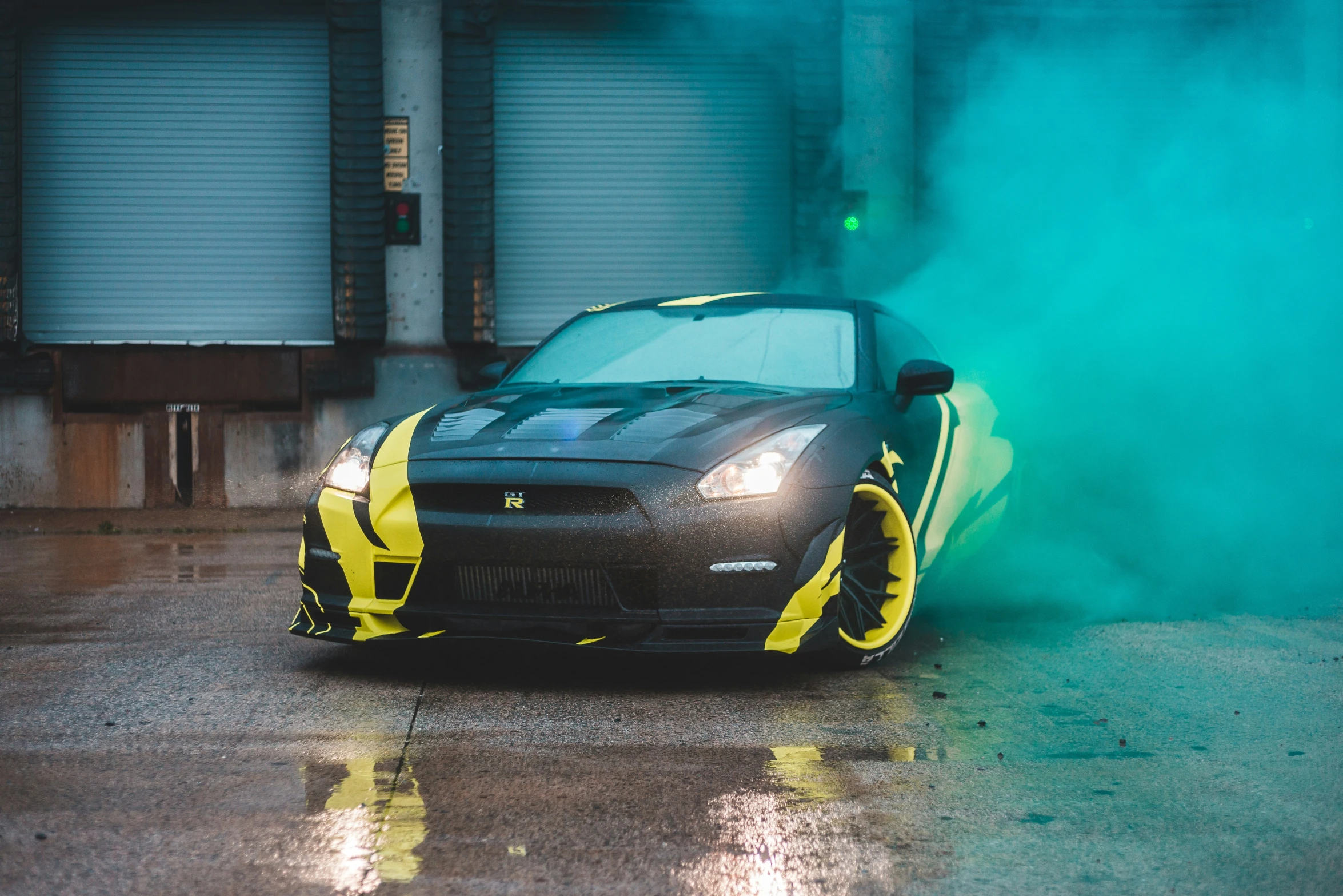 a car parked inside a garage with a lot of smoke in the front