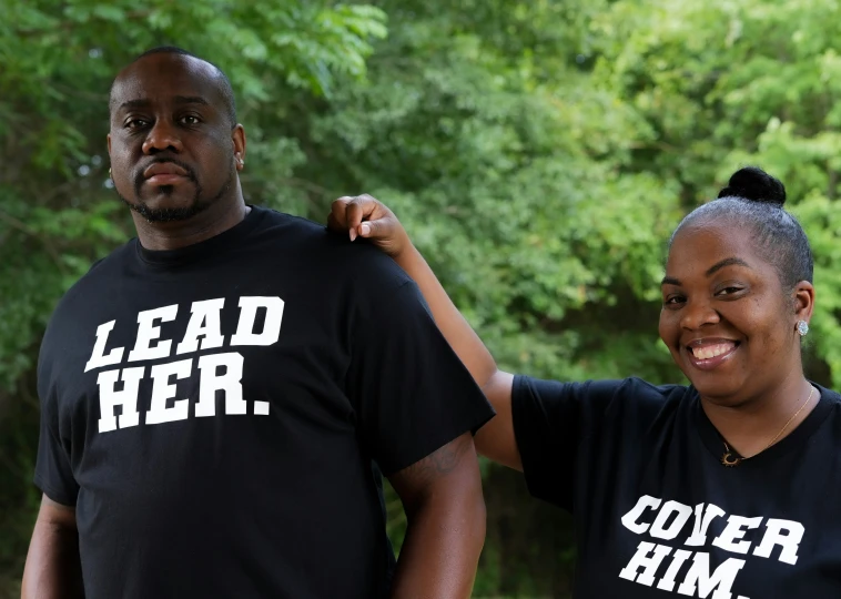 a black man and woman wearing t - shirts that read lead her