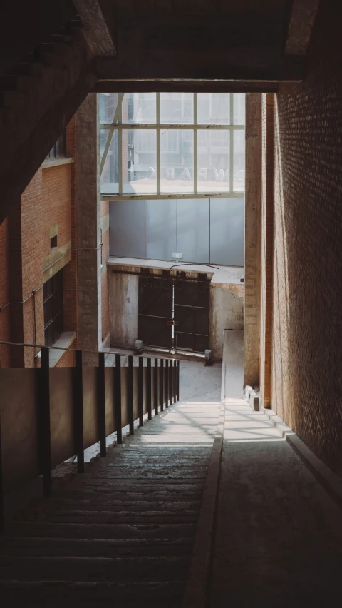 a brick building with doors and floors to exit into another area