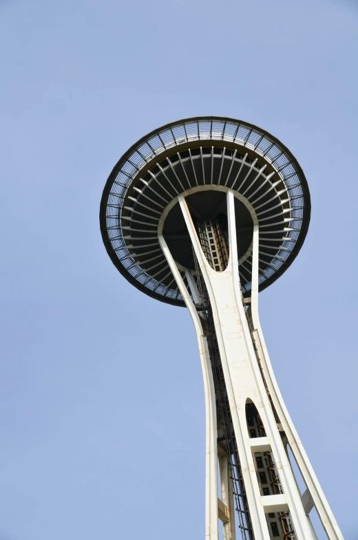 the top of a tall tower against a blue sky