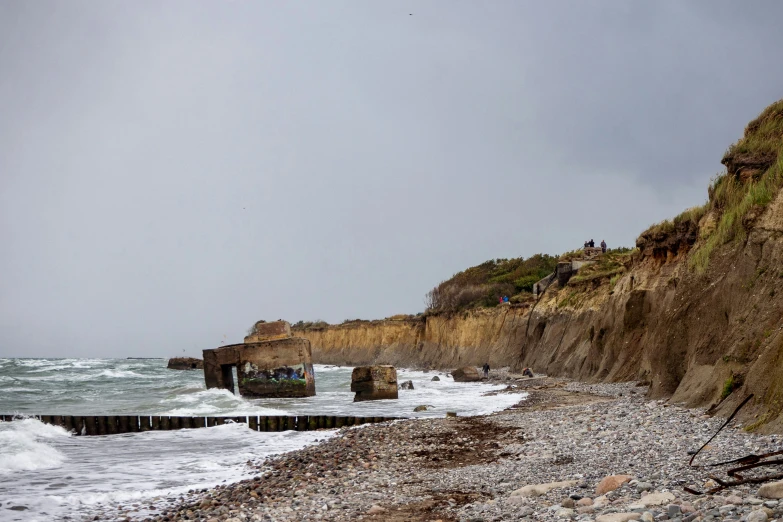 a view of a beach and ocean with rocks