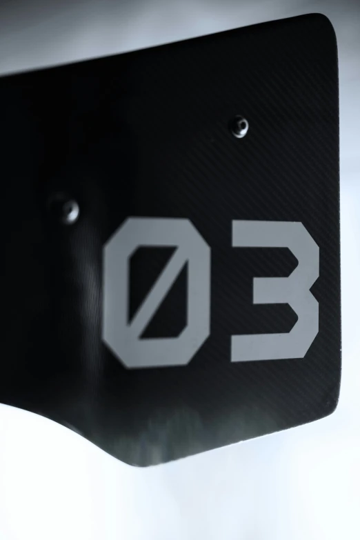 a metal sign that has the letter d on it