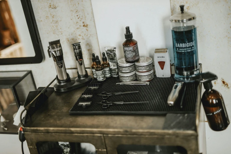 a metal table topped with bottles and a coffee pot