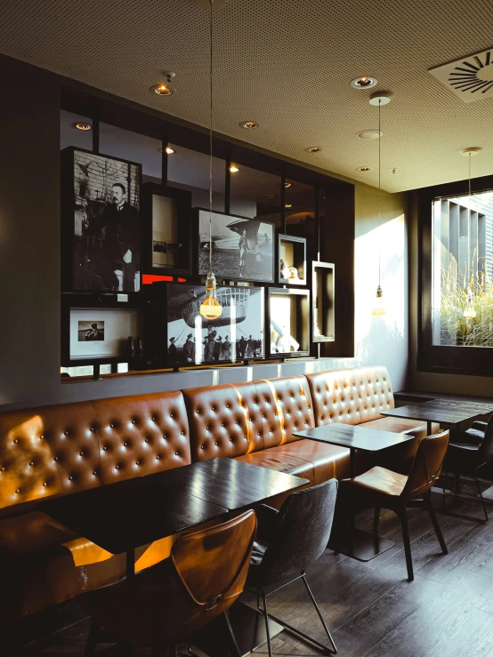 a large brown couch in a dark restaurant