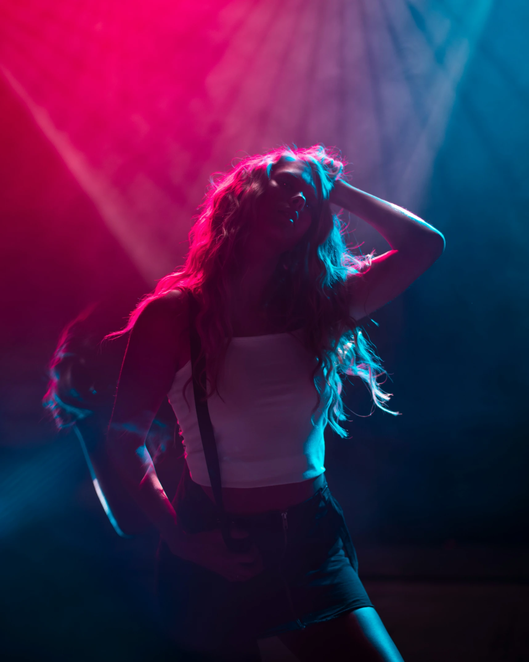 a woman standing on stage in a club