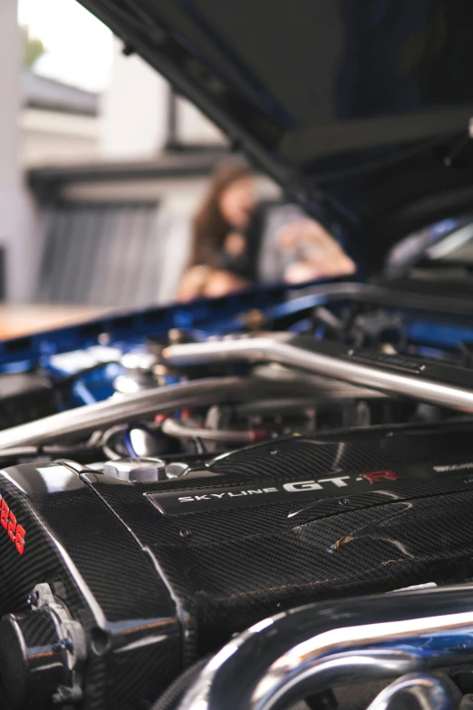 the front end of a car with some equipment underneath