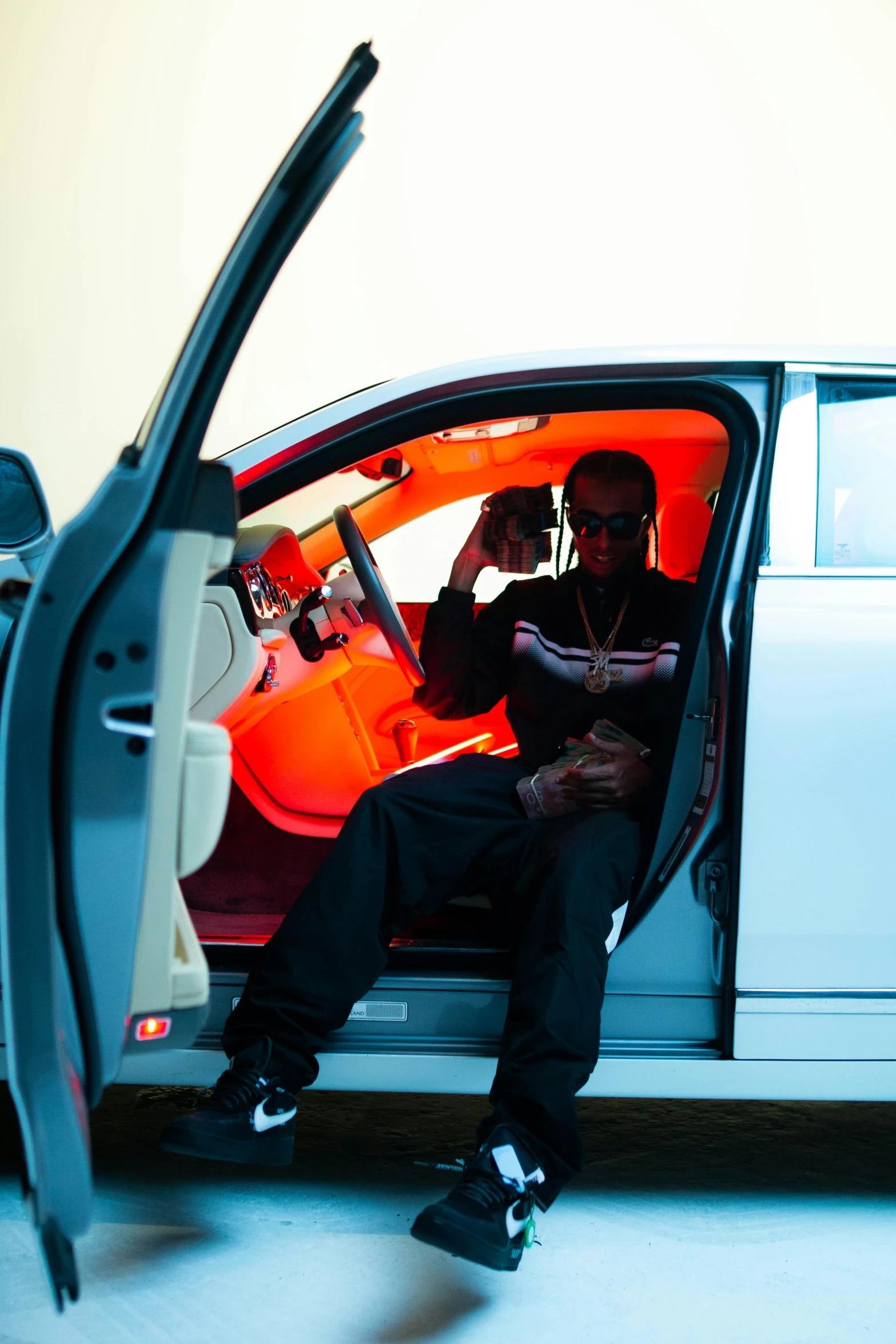 two people are sitting in the back seat of a car