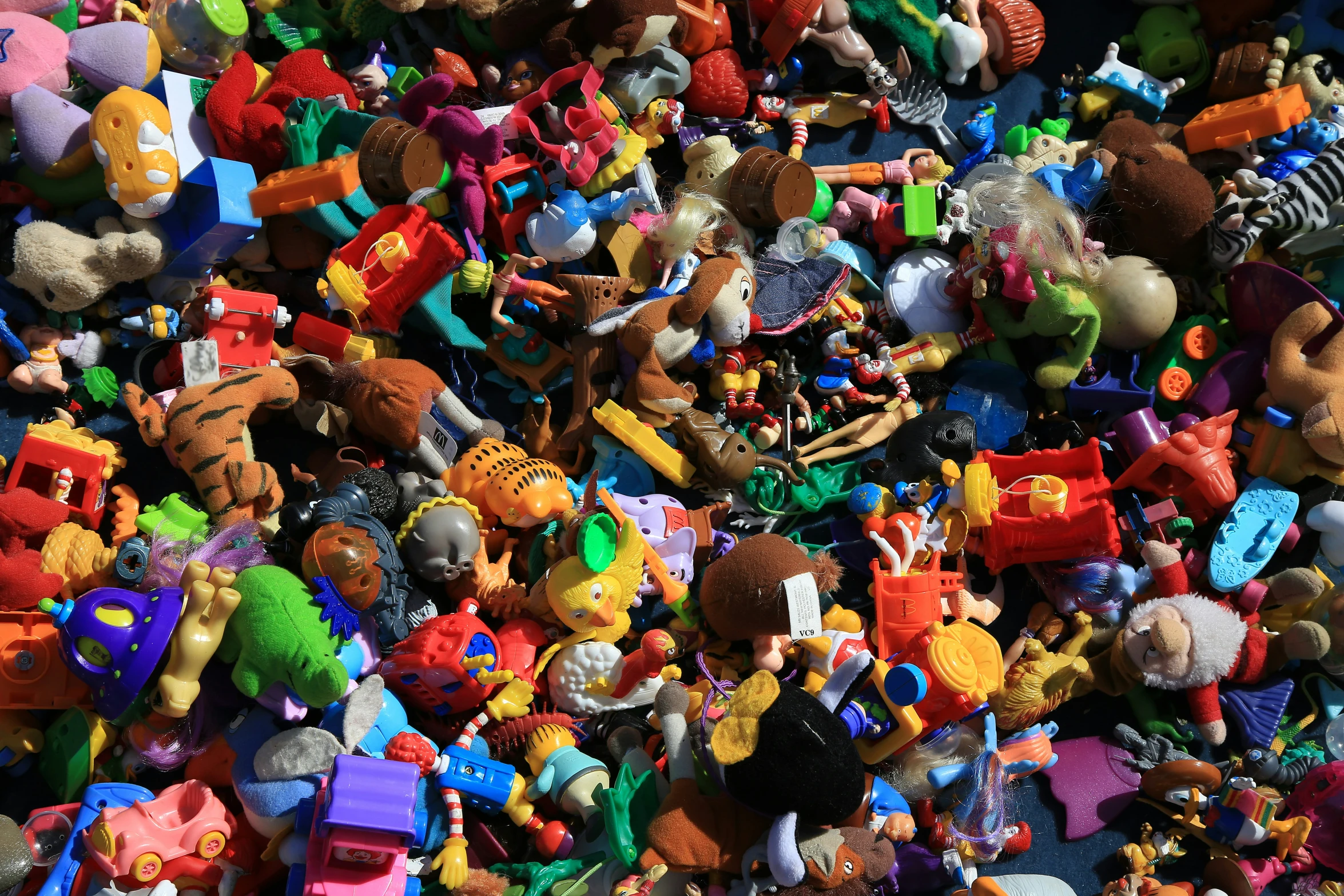 many toy animals together and one is full