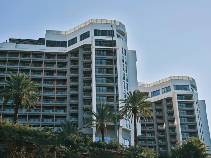 a big building that is near some trees