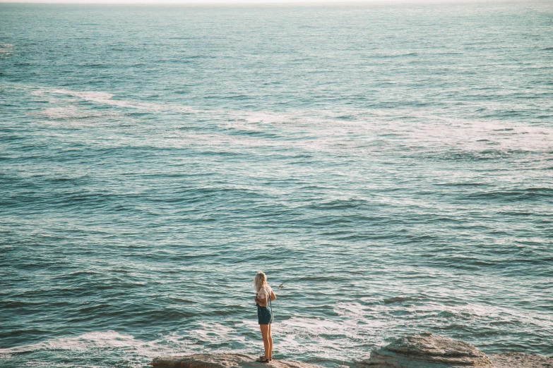 a person looking out at a body of water