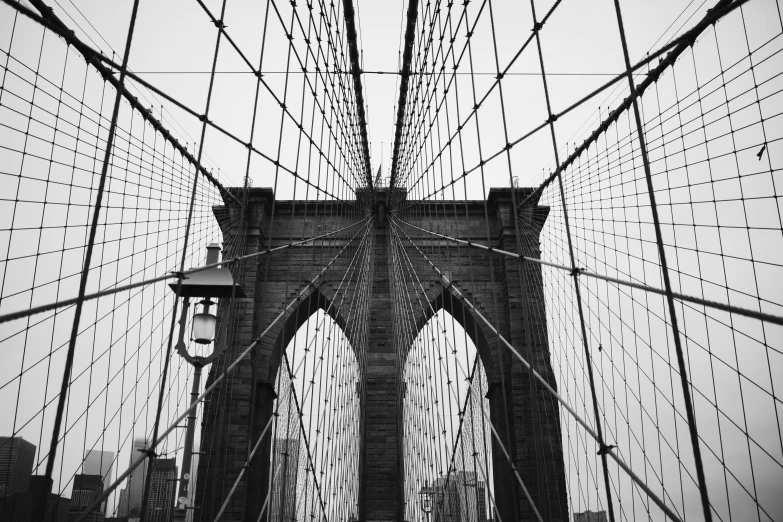 the view from below the brooklyn bridge at an angle