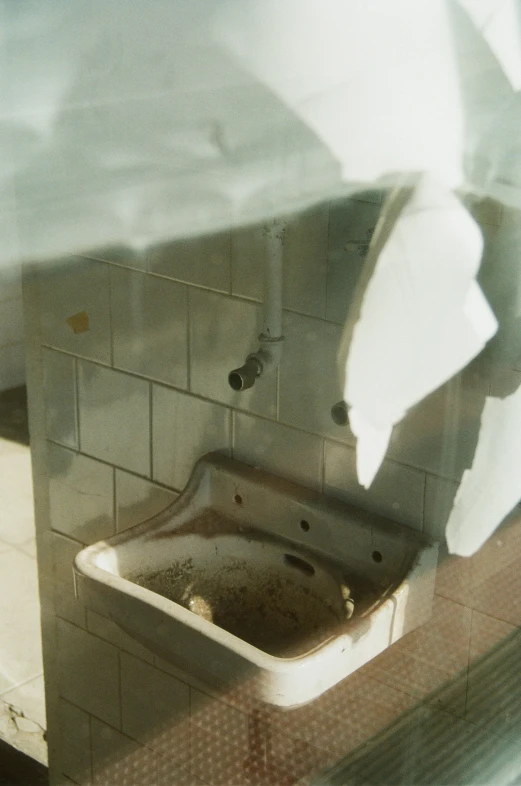 a mirror reflecting a sink and counter in the bathroom