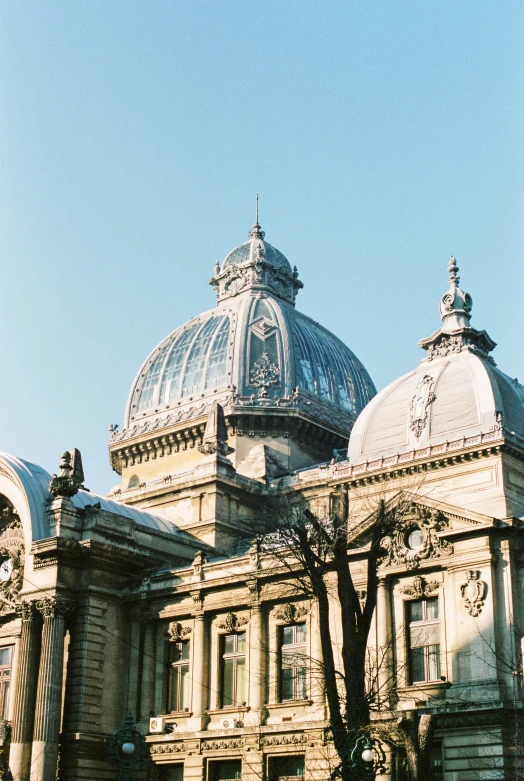 an ornate stone building with glass domes