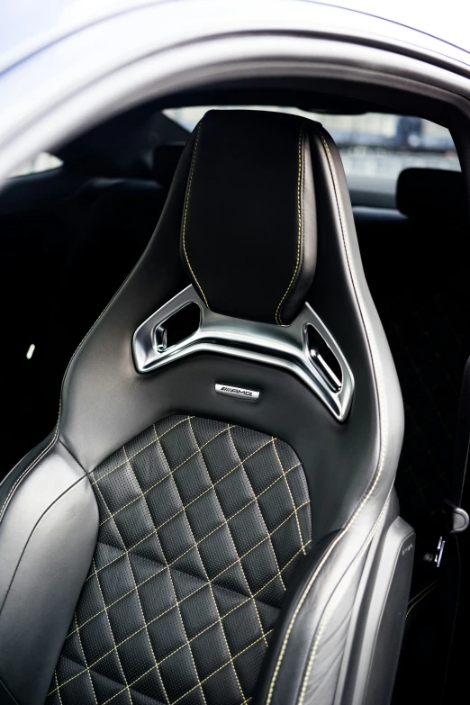 an inside view of a car with black and tan cloth