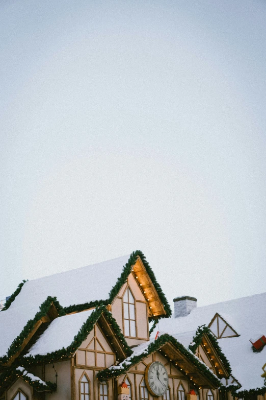 a christmas house is decorated with garlands and lights