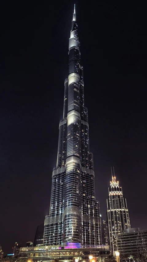 a tall building lit up in the night sky