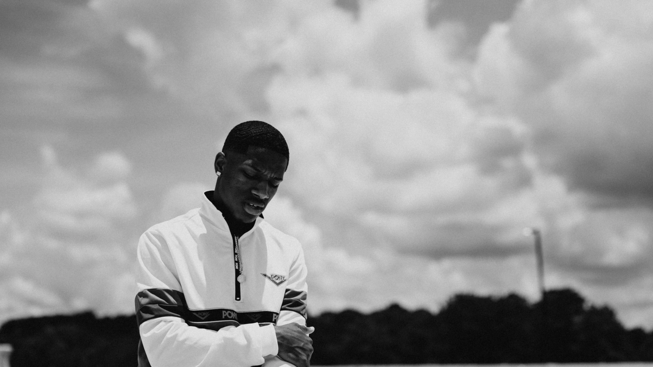 a man that is standing in the grass