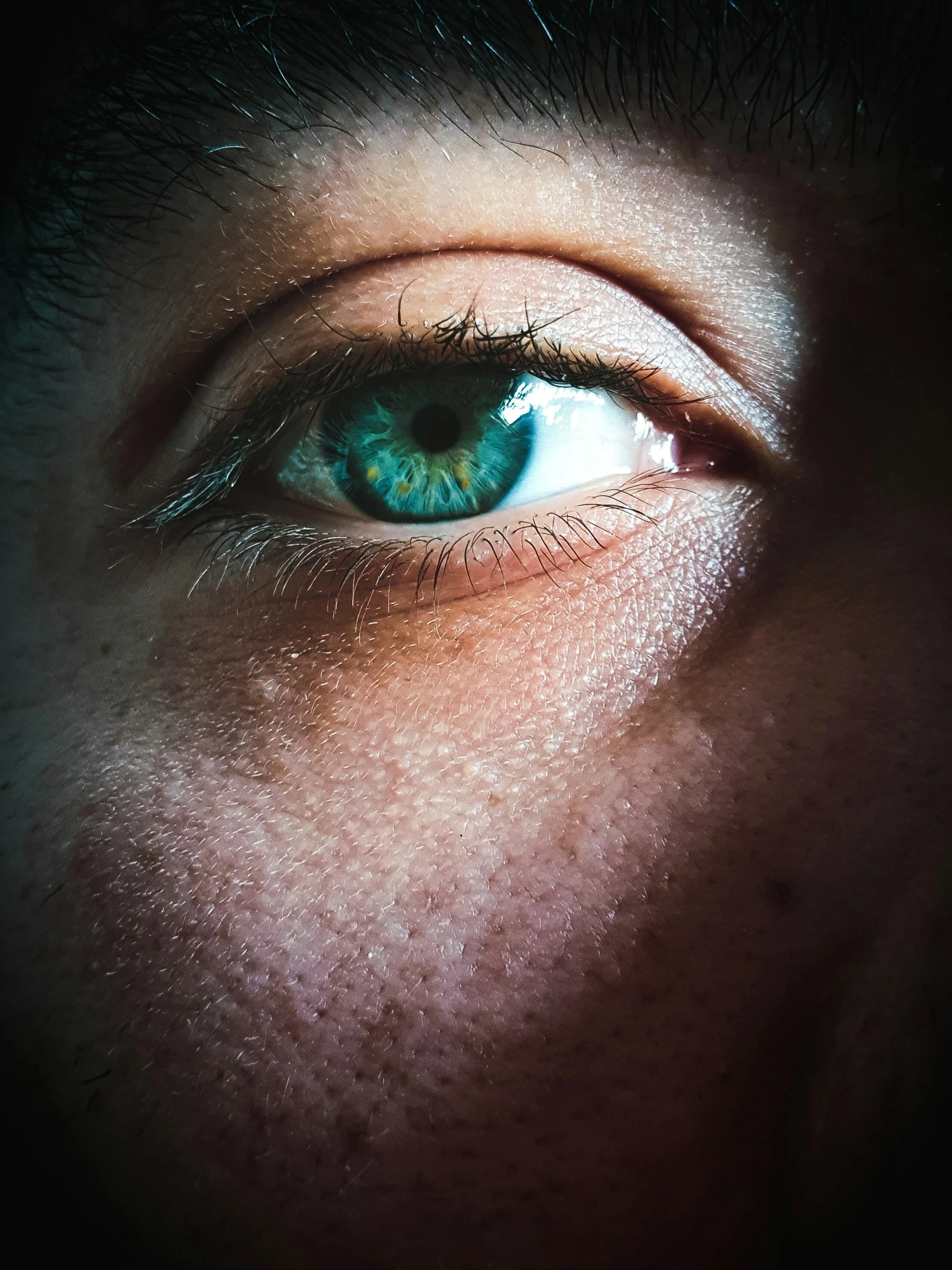 a person with green eye closeup s