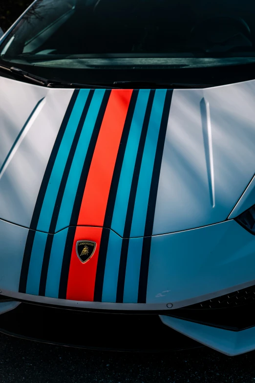 the car is painted blue and red with black stripes