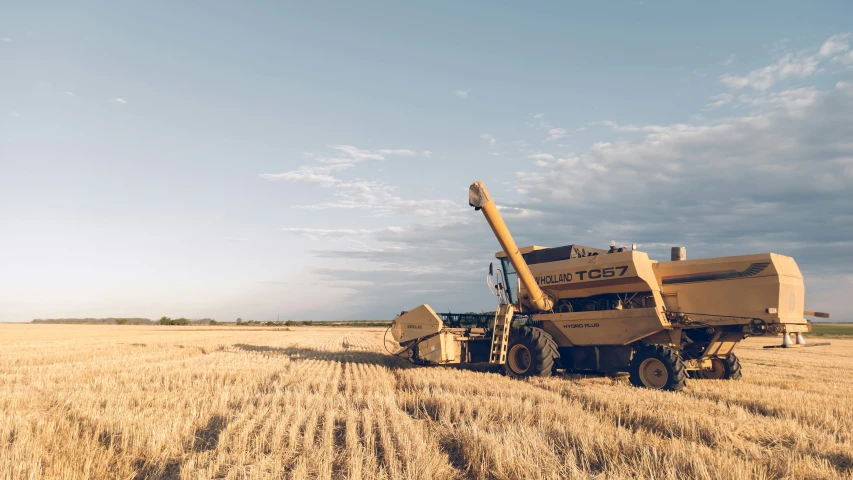 a grain planter is harvesting grain in the middle of nowhere