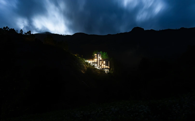 a building in the distance lit up at night