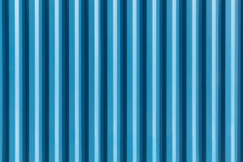 a bright blue tin roof with vertical strips