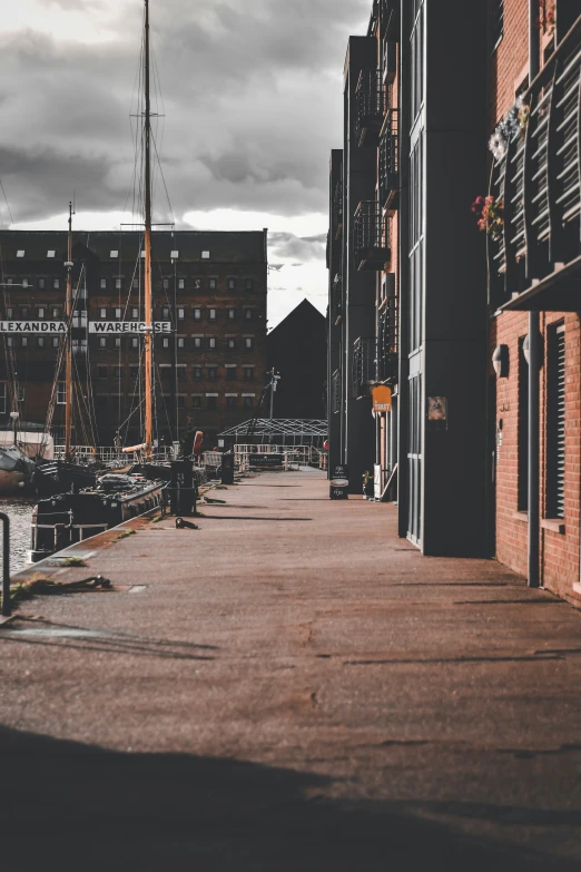 a city street that has a few boats parked along it