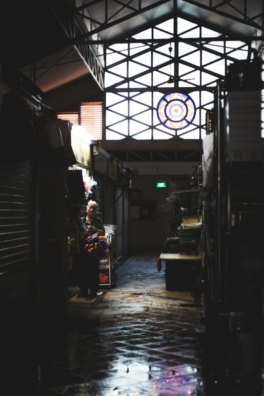 a long hallway with many objects hanging on the ceiling