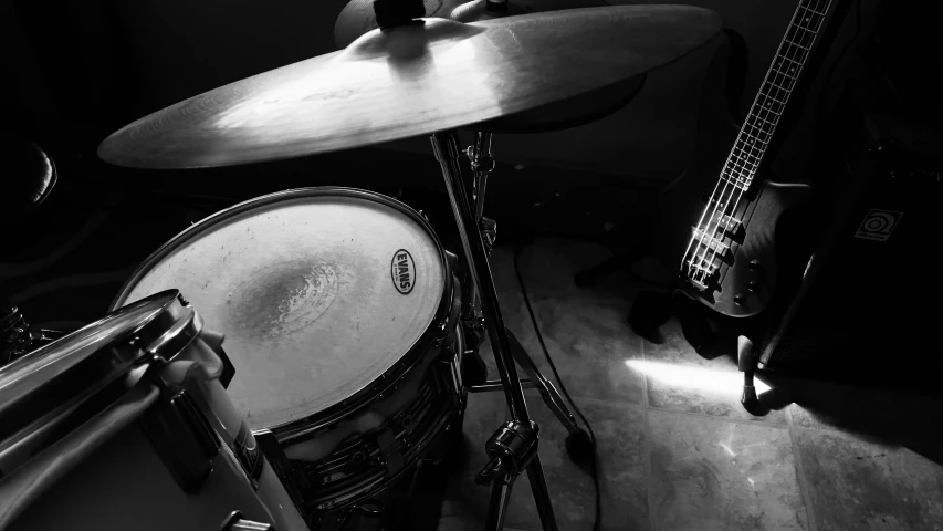 the drums are sitting behind the heads of the instrument