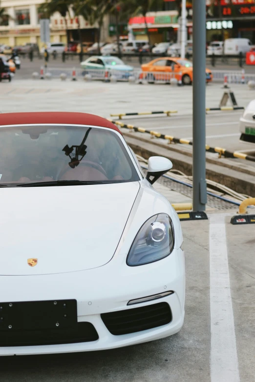 the sports car is driving near a train tracks