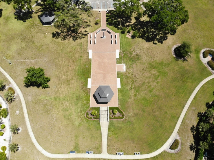 an aerial view of the house with lots of trees around it