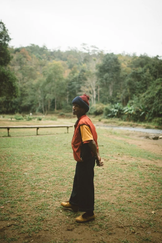 a woman holding a baseball on a field