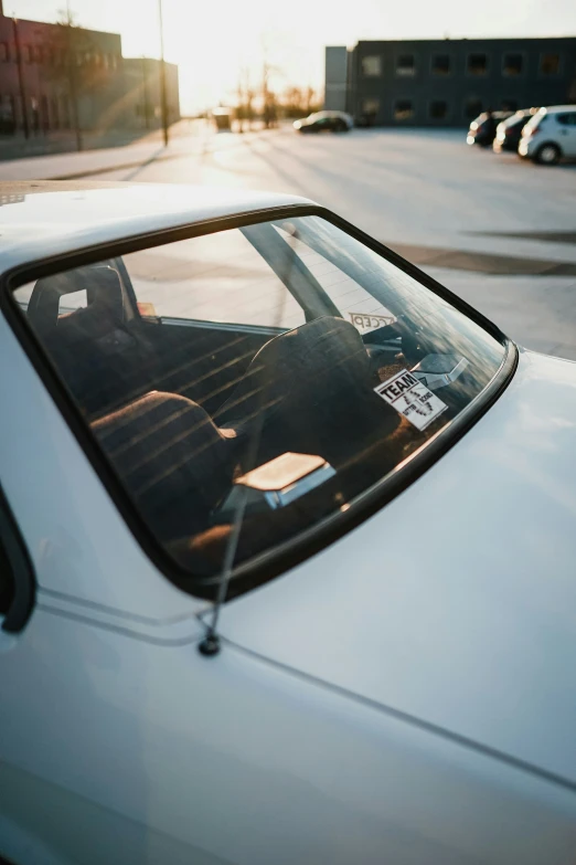 a parked car sits in front of another car