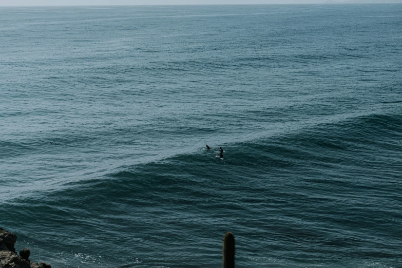 the surfer is riding a wave on his surfboard