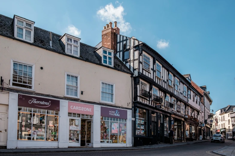 the storefronts of businesses at the center of town