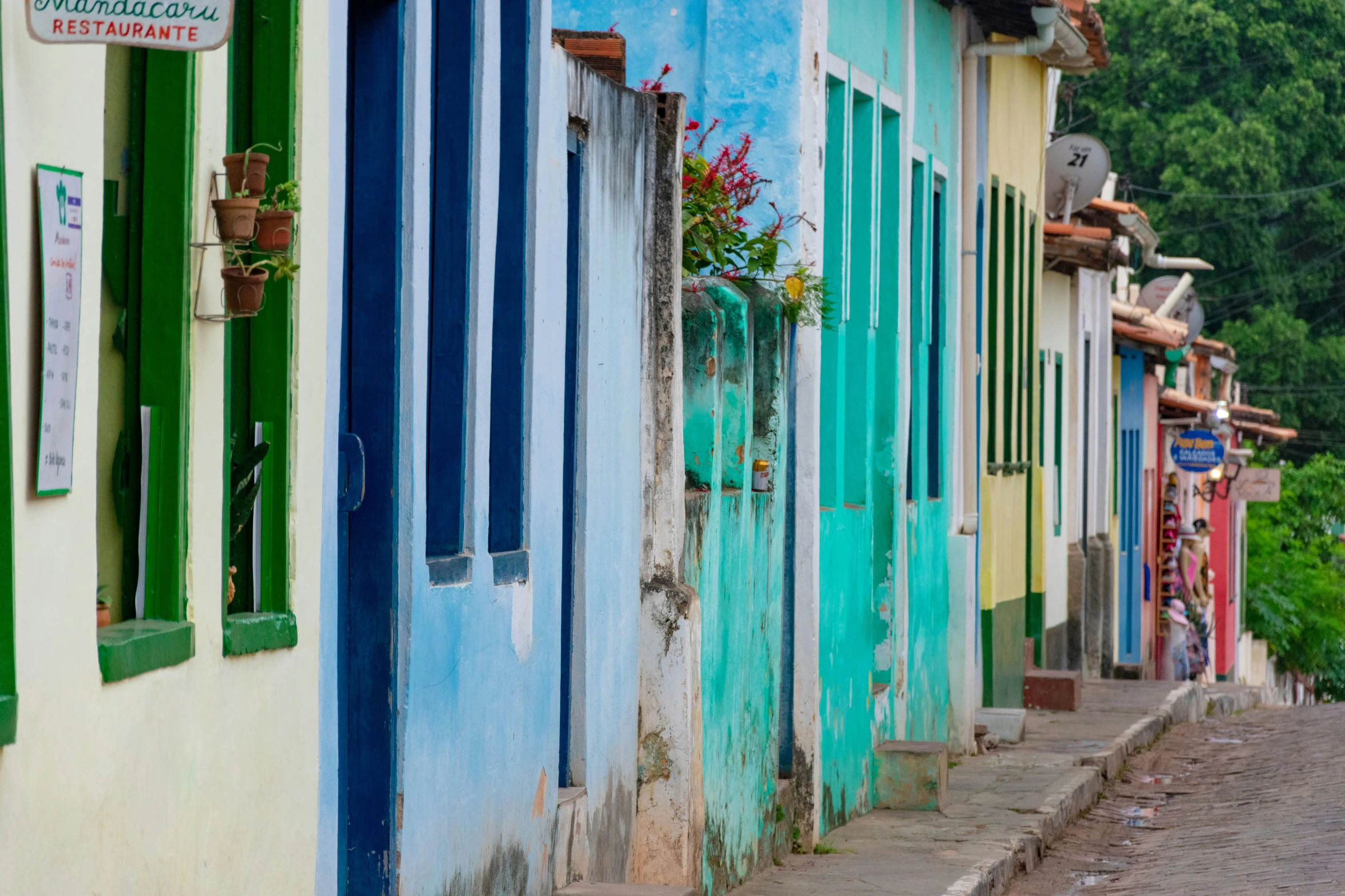 many colorful houses with window and door panes