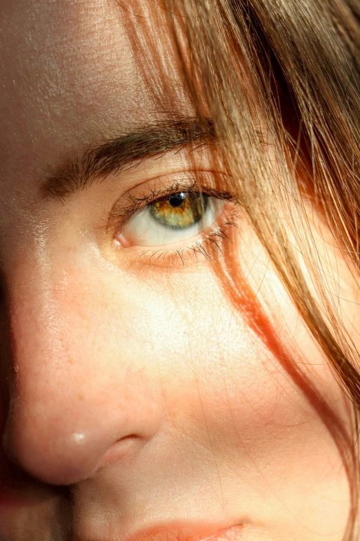 close up s of a lady's face with an unkempt hair