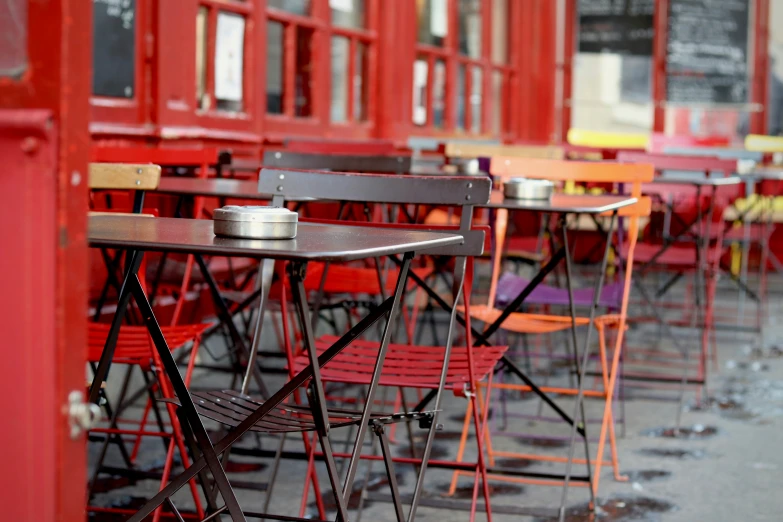 there are tables and chairs outside of this restaurant