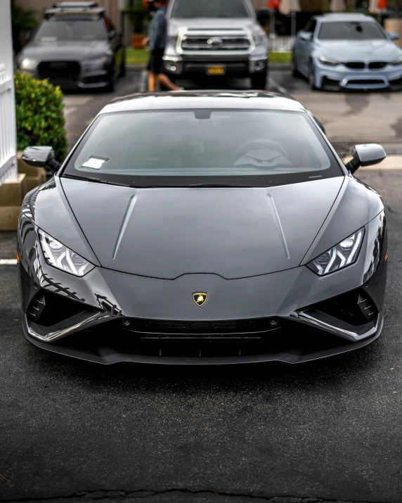 a black lamb car parked in the middle of a street