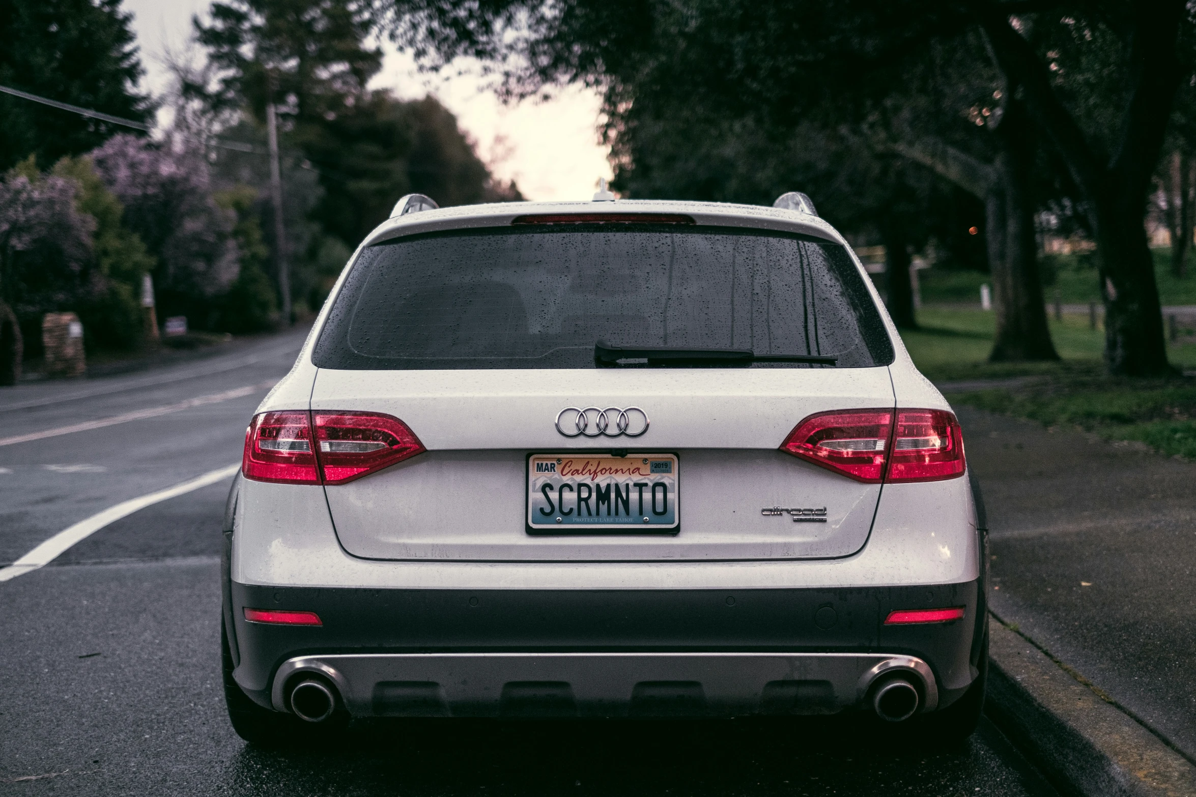 an audi suv is parked on the street